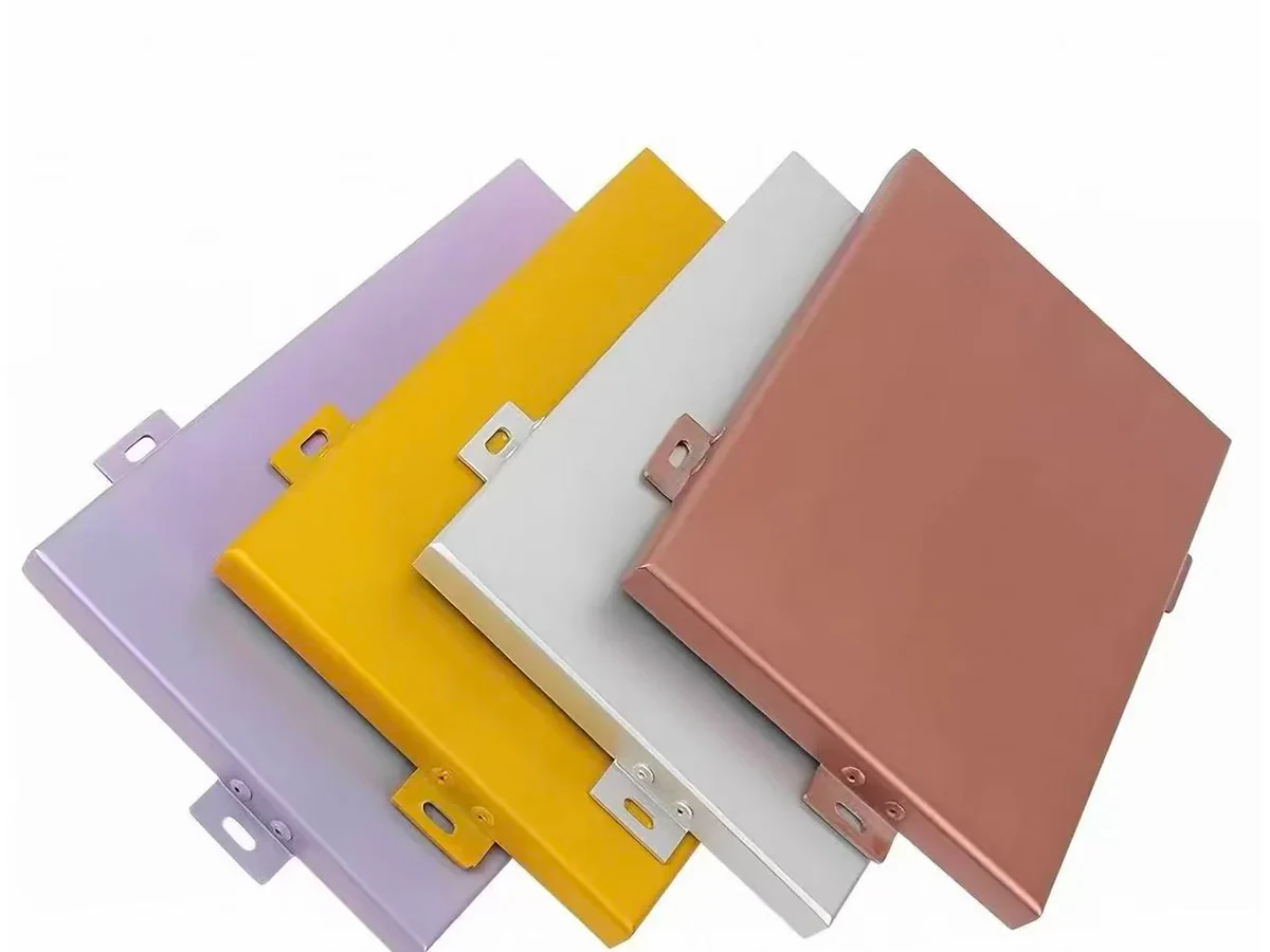 Four real fluorocarbon-coated solid aluminium panel samples with folded edges and fixing tabs
