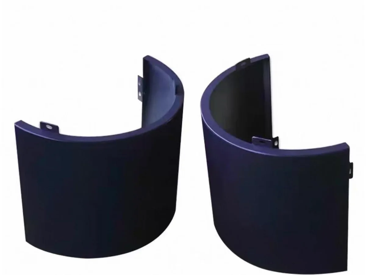 Two real dark blue curved aluminium column cladding panel sections with fixing tabs