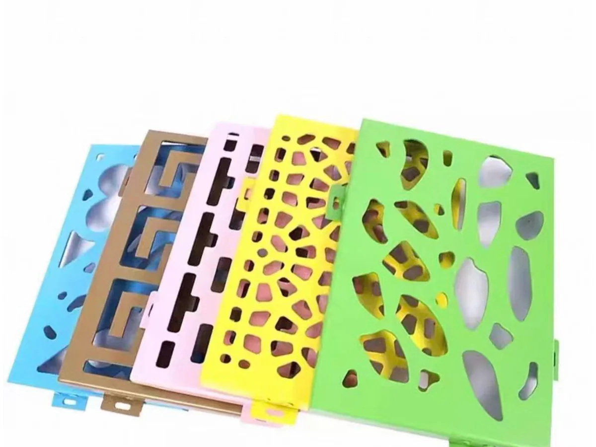 Real decorative aluminium panel samples in multiple colours with geometric and organic cut-out patterns