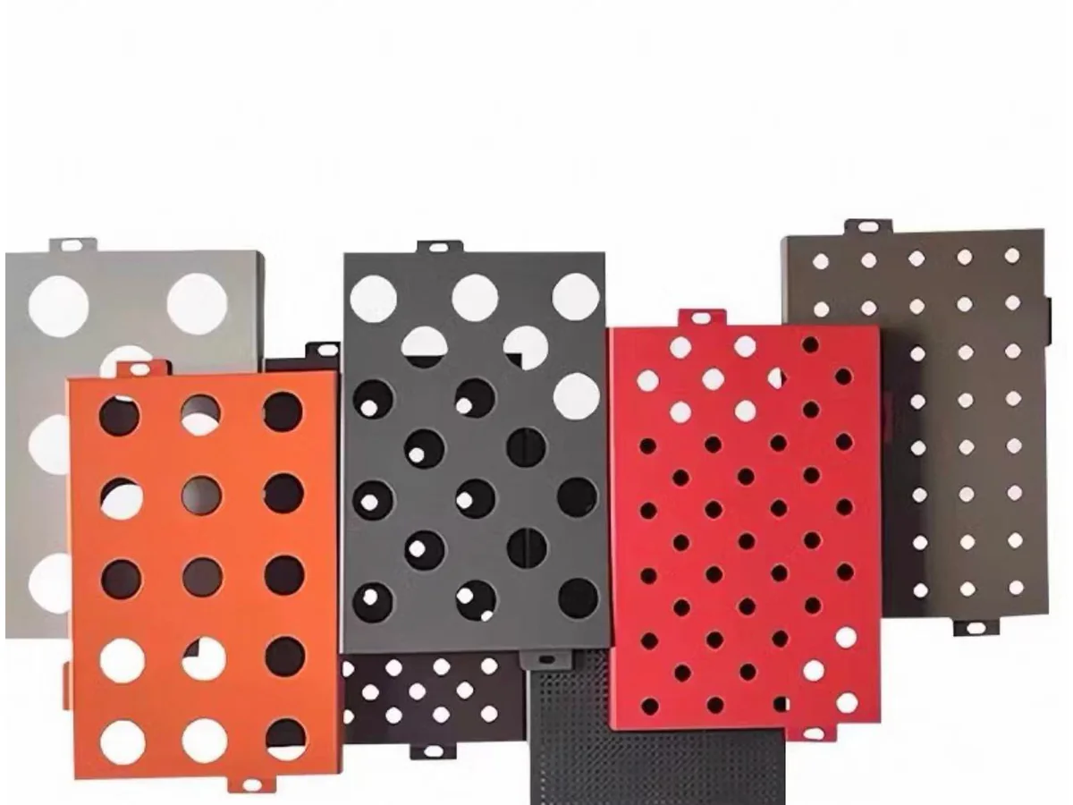 Real perforated aluminium panel samples showing varied round-hole sizes, colours and folded edges